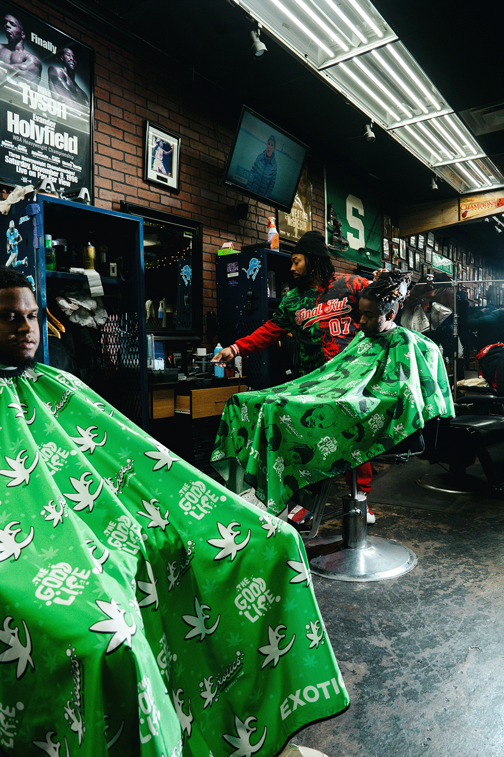 Exotics barber capes in use in barber shop