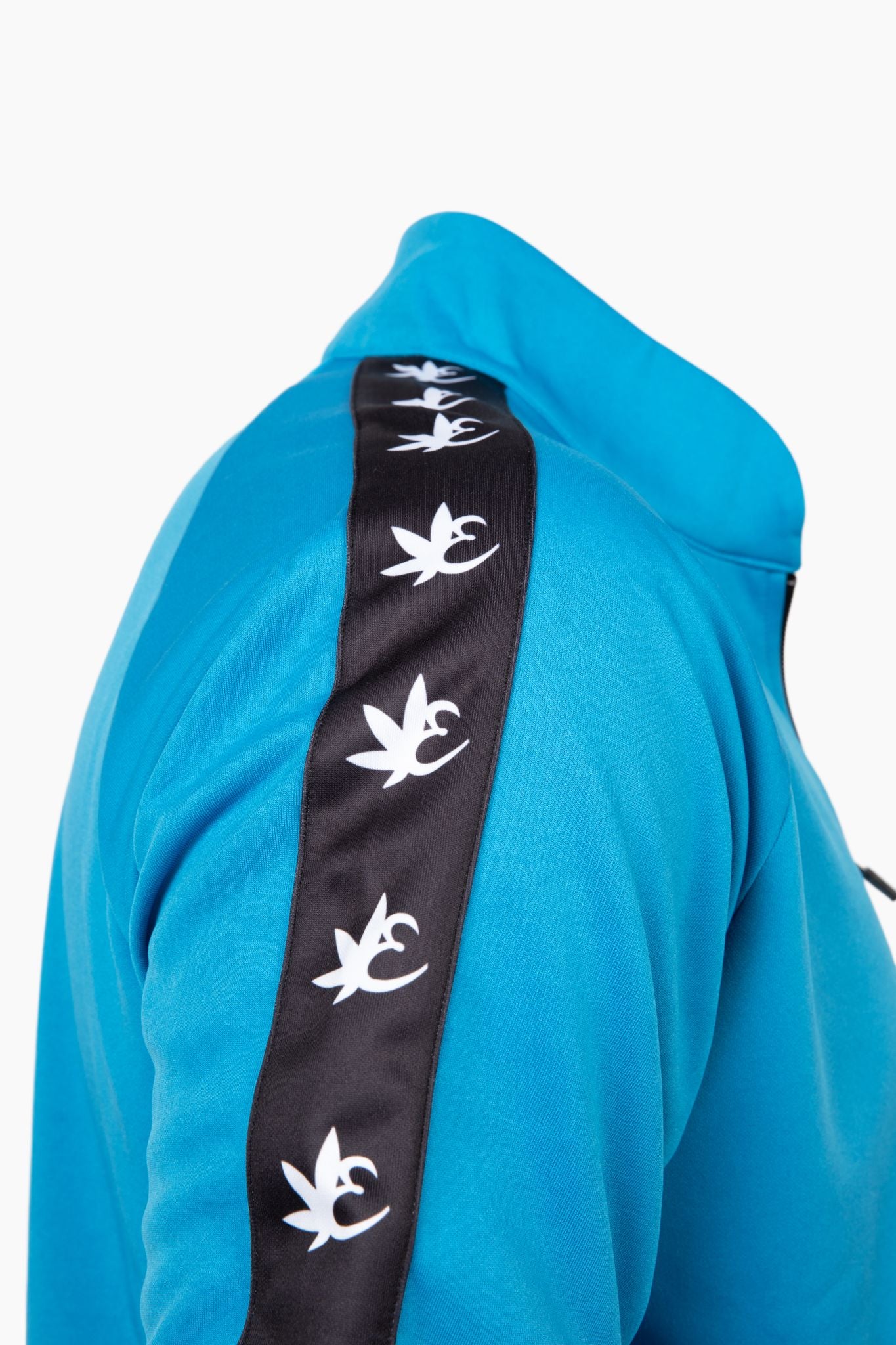 Blue Exotics tracksuit shoulder detail of black logo stripe