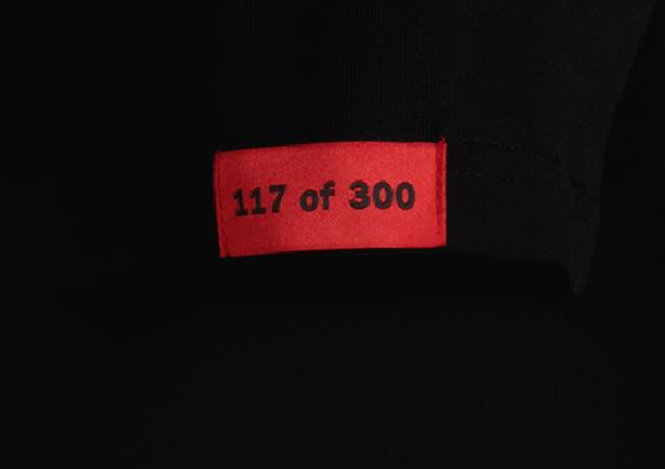 Red sleeve tag on black Michael Myers Exotics tee t-shirt