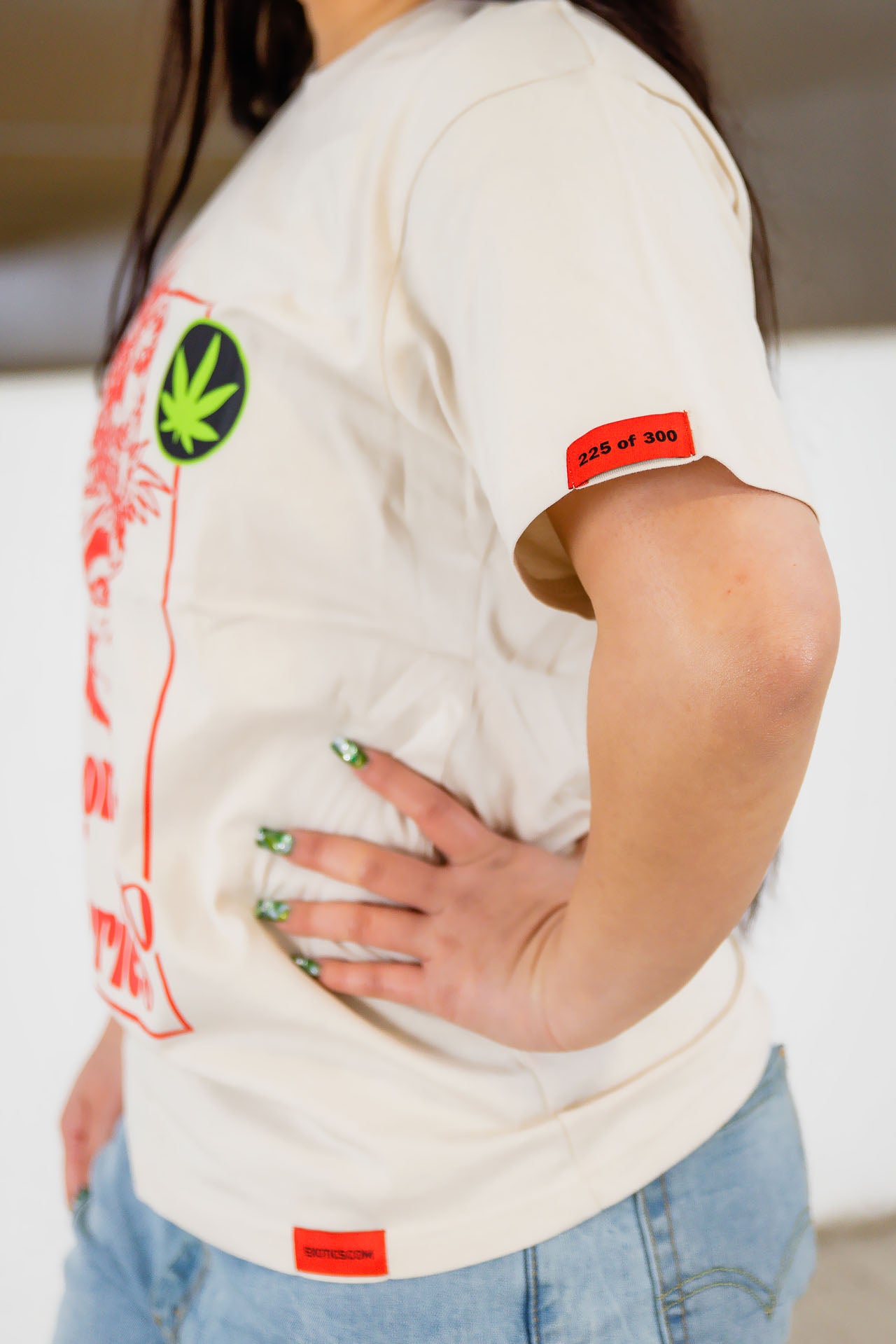 Side view of woman wearing Exotics Monkey Berries tee t-shirt
