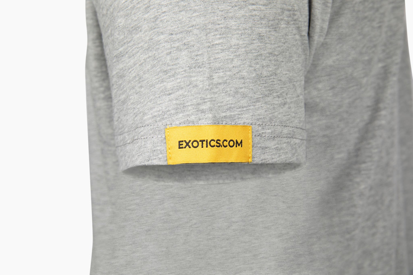 Gray Exotics tee t-shirt with orange tag on left sleeve