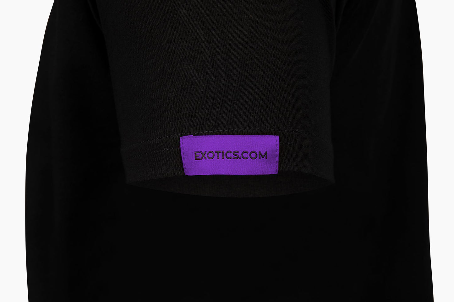 Black Exotics tee t-shirt with purple tag on left sleeve