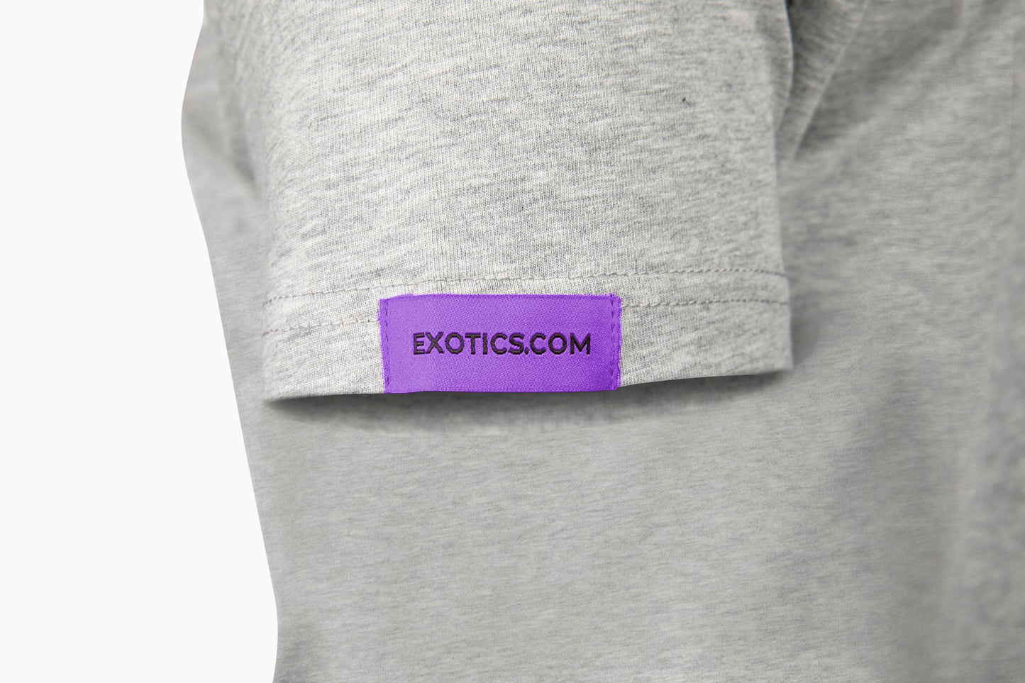 Gray Exotics tee t-shirt with purple tag on left sleeve