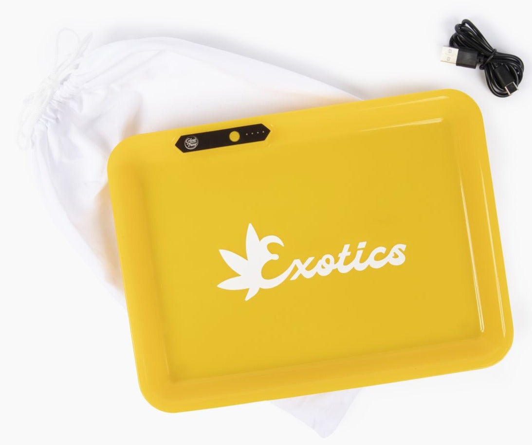 Yellow valet tray with white Exotics logo