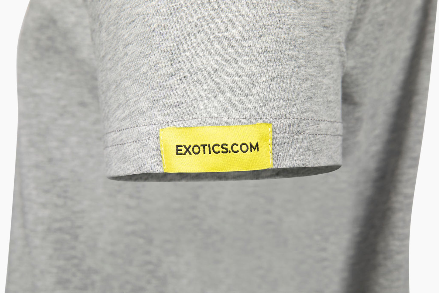 Gray Exotics tee t-shirt with yellow tag on left sleeve
