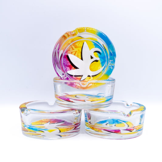 Four clear Exotics ashtrays with rainbow logo