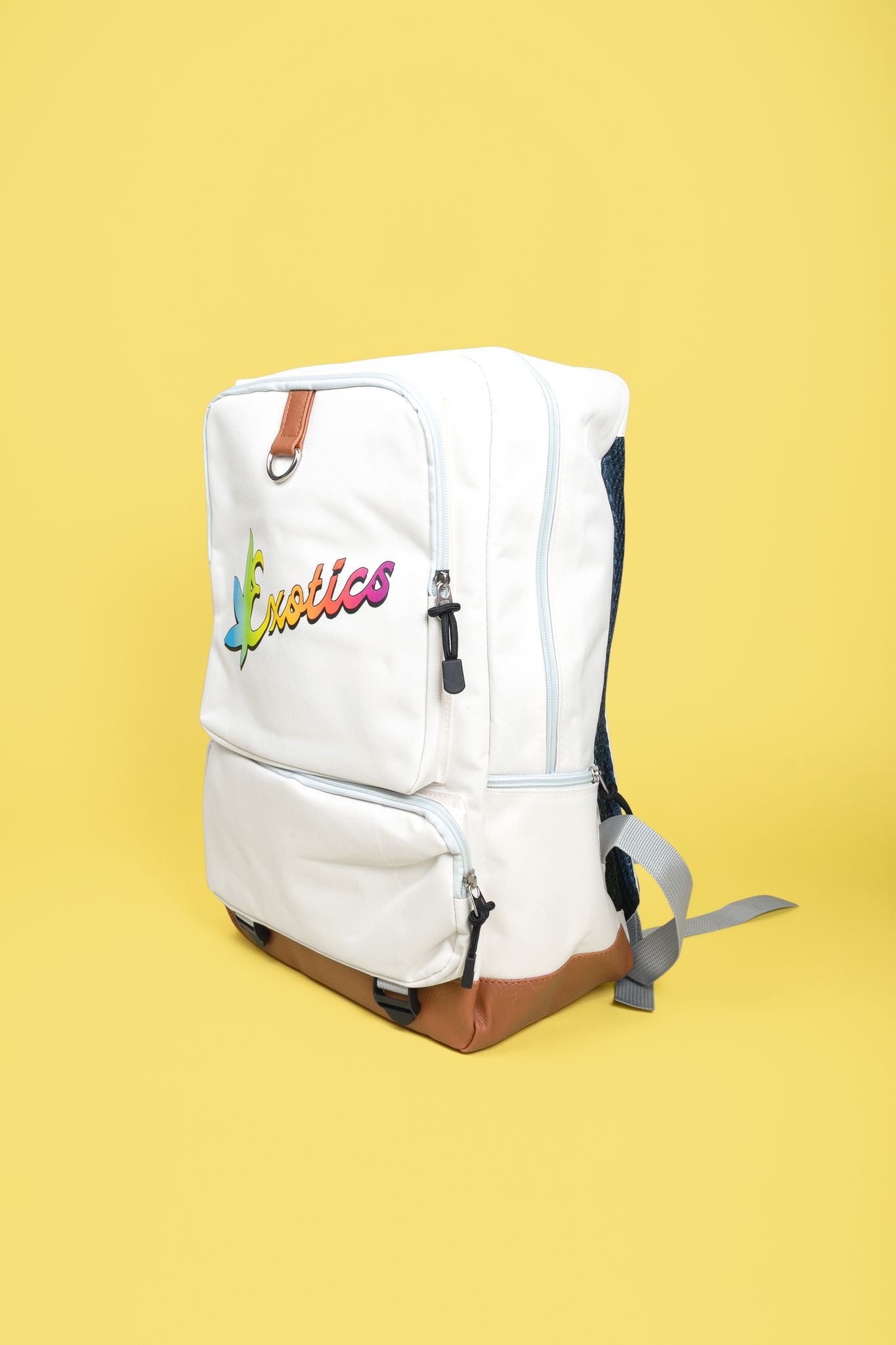 White Exotics backpack with rainbow logo on yellow background